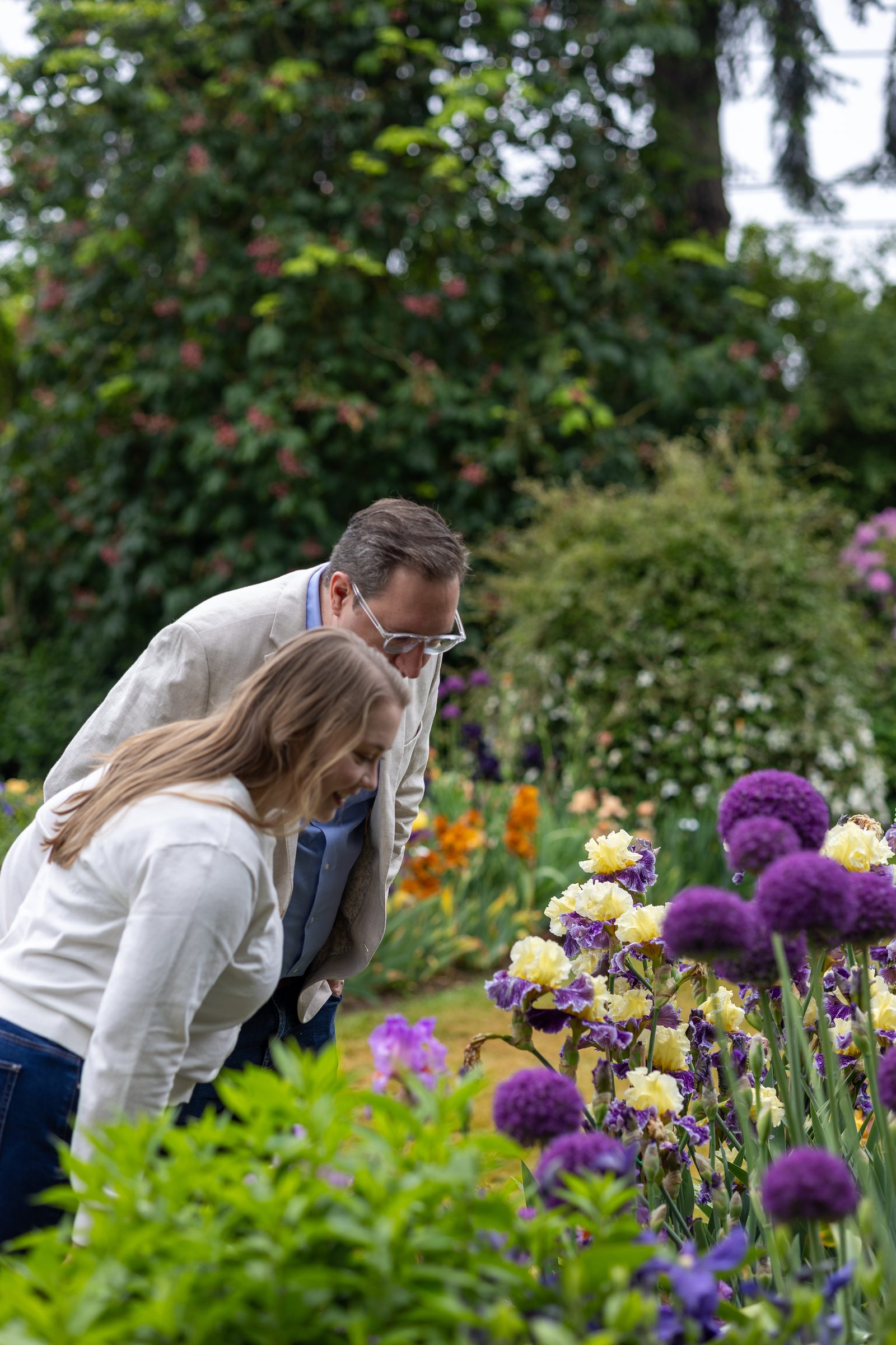 Rachel and Daniel leaning in to admire the flowers together