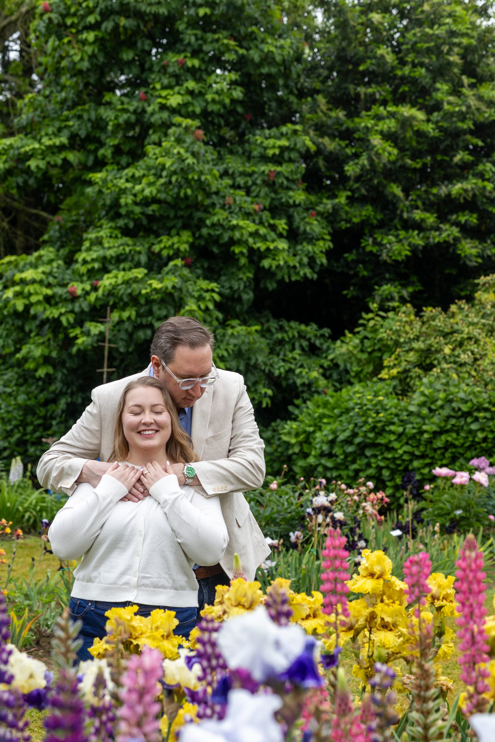 Daniel embracing Rachel among the flowers