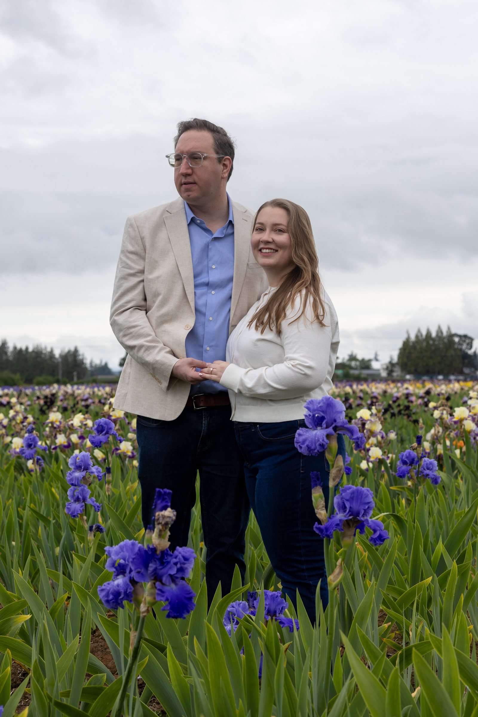 Rachel and Daniel standing together in the iris fields