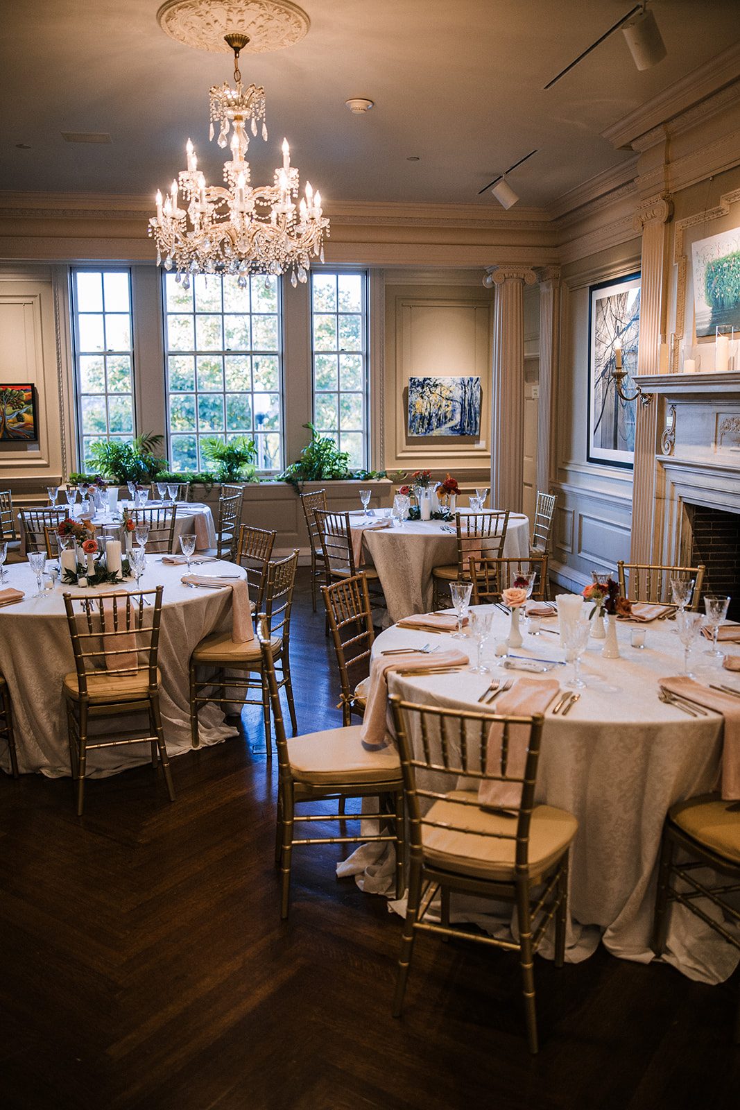 Dining room set for reception with crystal chandelier