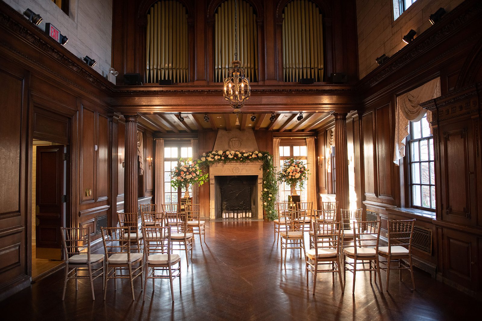 Music Room ceremony setup with organ pipes and floral arrangements